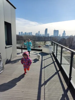 10 Reasons Why Westies Are Good with kids : Westie running around a terrace with kids for play